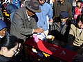 Writer creating an Duìlián in Lijiang